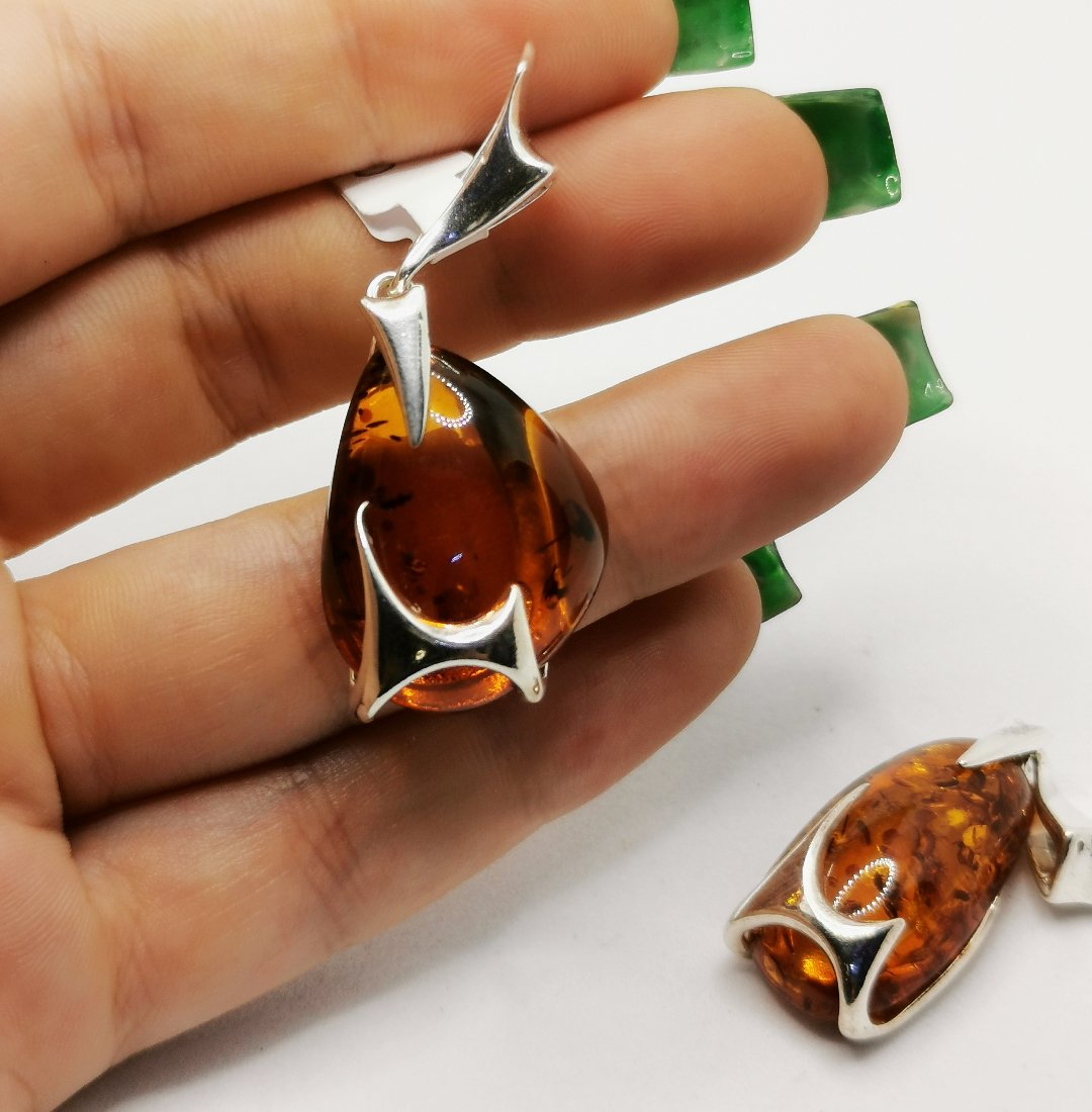 Liquid silver amber pendant